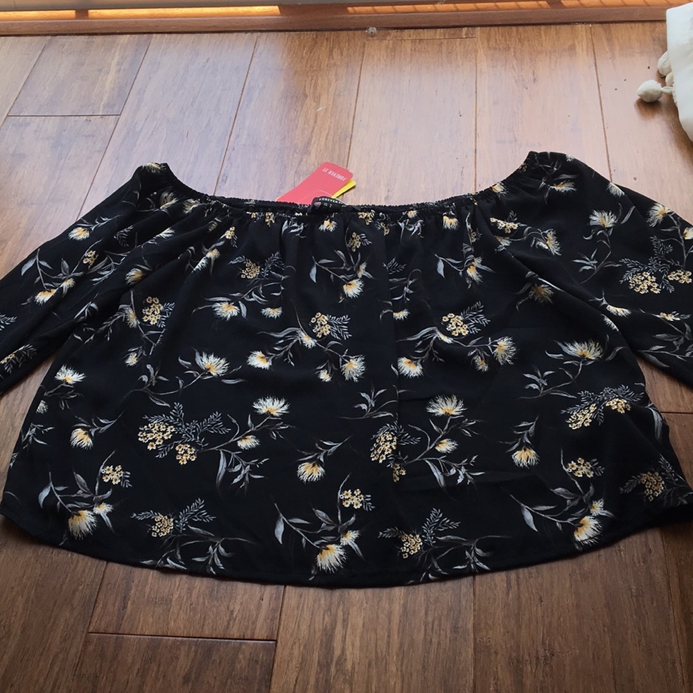 Black off the shoulder shirt with flowers